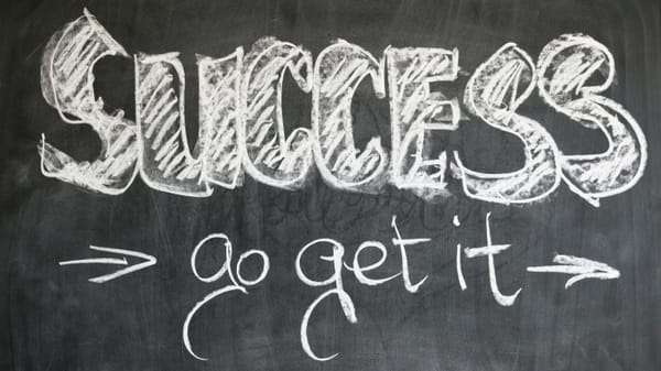Chalk on a blackboard:  SUCCESS -> go get it