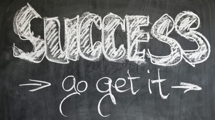 Chalk on a blackboard:  SUCCESS -> go get it
