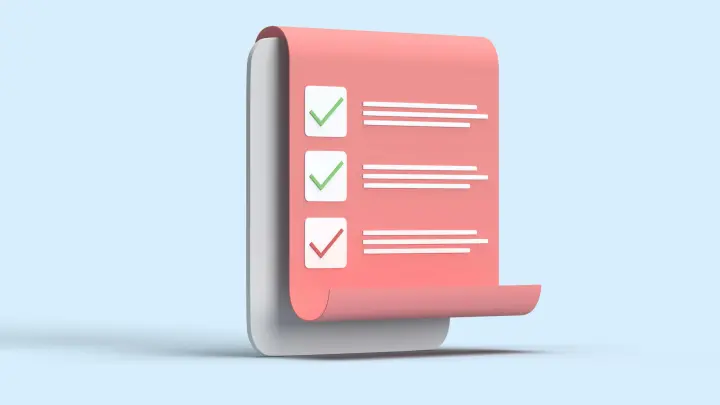 Pink paper with green checkmarks and white writing on it against a blue background.