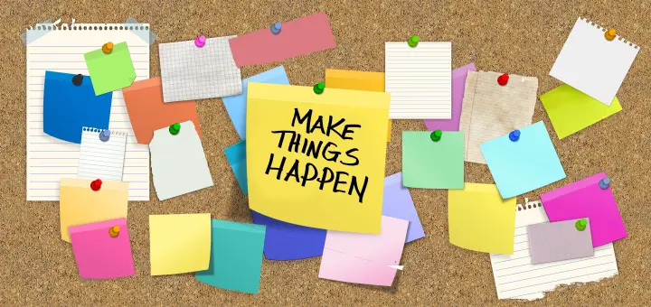 Bulletin board with many blank post-it notes; the one in the center contains: Make Things Happen.