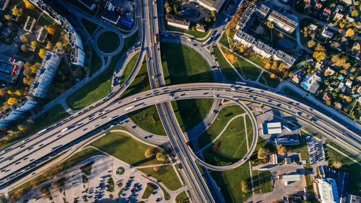 Highway interchange and buildings viewed from above.