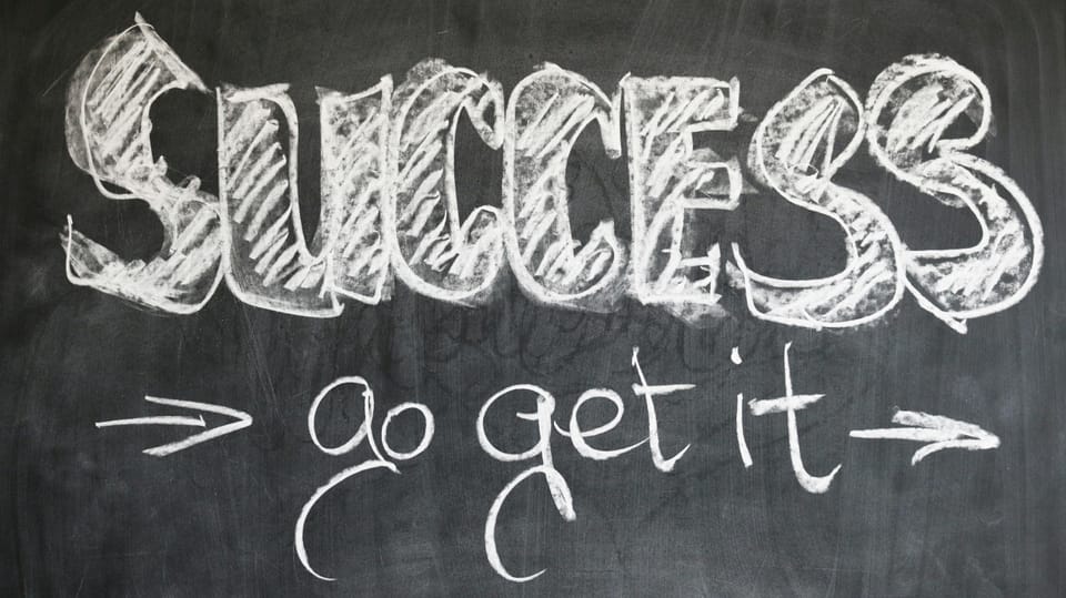 Chalk on a blackboard:  SUCCESS -> go get it